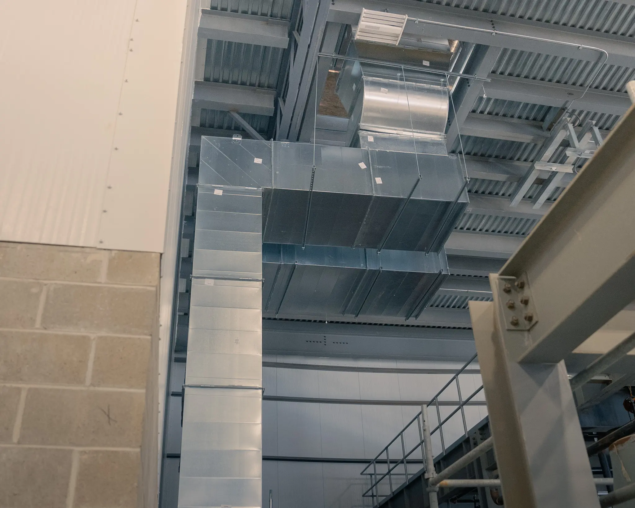 DePue team forming stainless steel ductwork