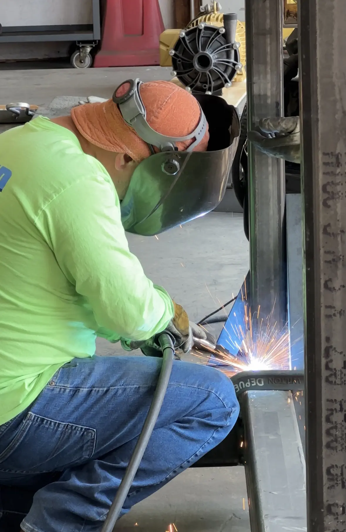 Journeyman pipe fitter welding on steel skid