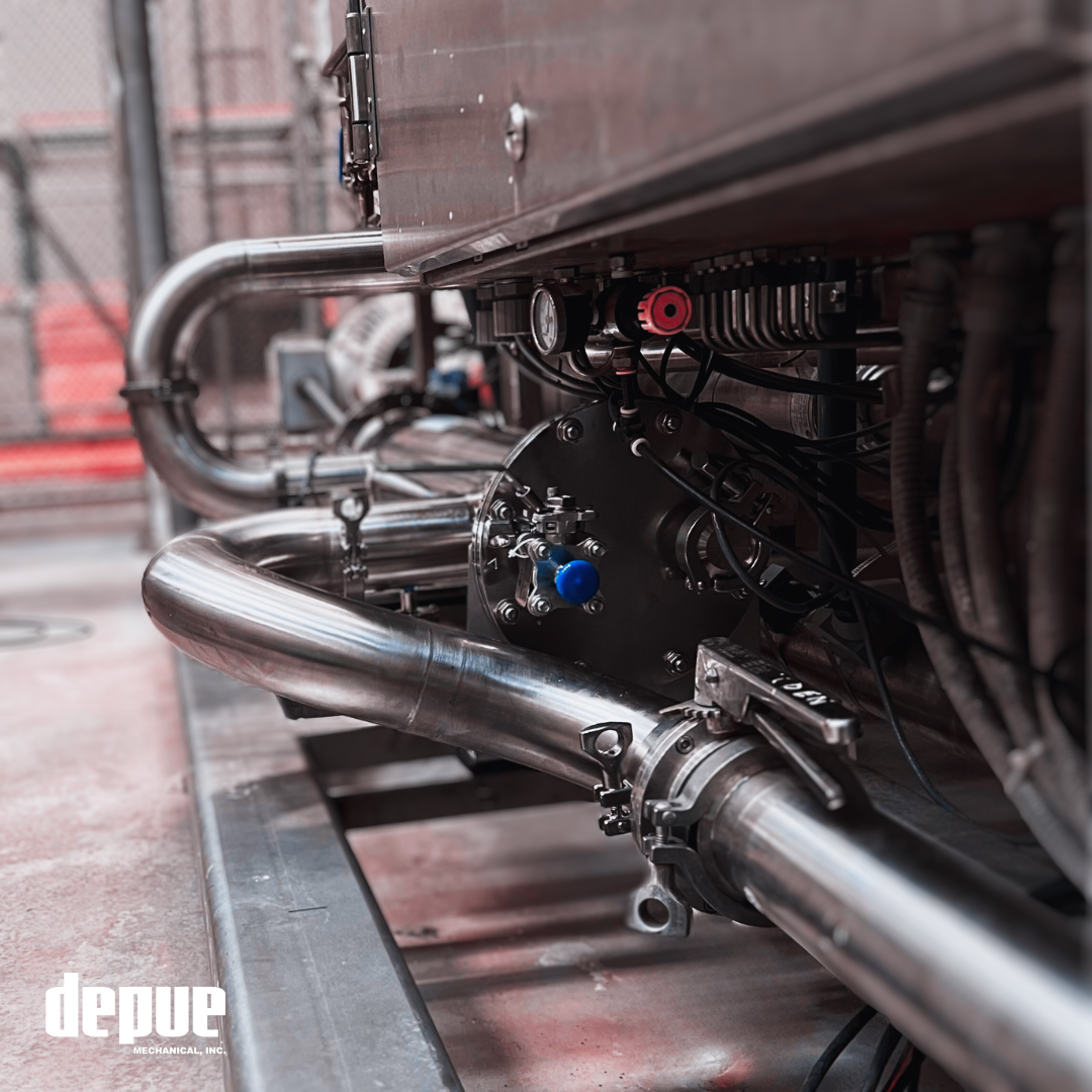 UV light filtration system integrated with sanitary piping, valve, and clamp fittings in beverage plant