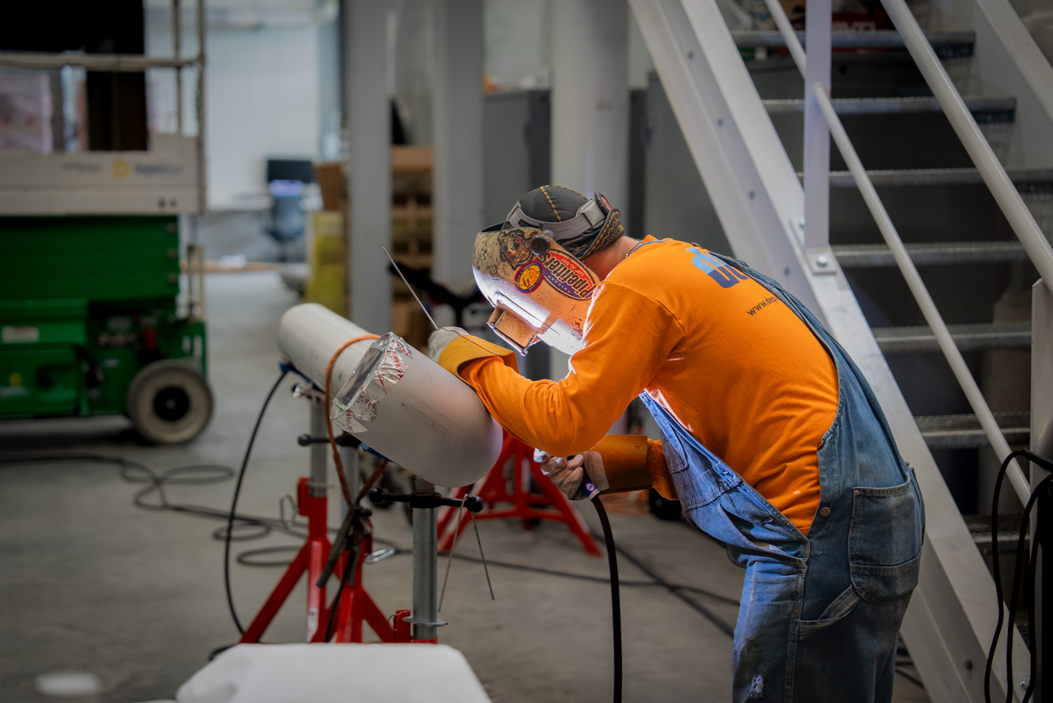 Welder performing pipe tie-in work for a planned industrial shutdown
